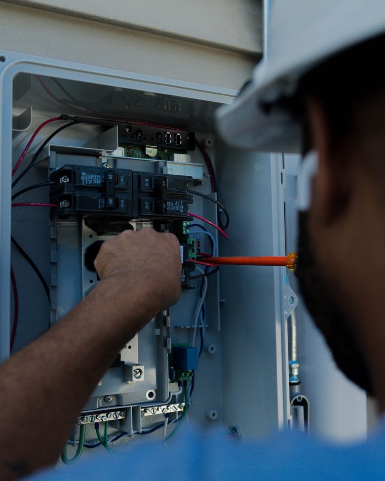 BHS electrician wiring a home electrical panel