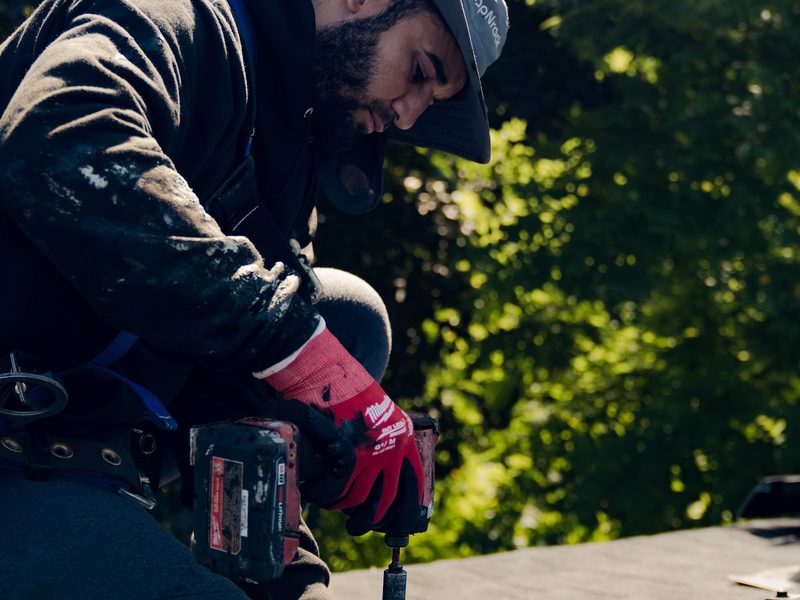 BHS installer fastening a rooftop solar panel